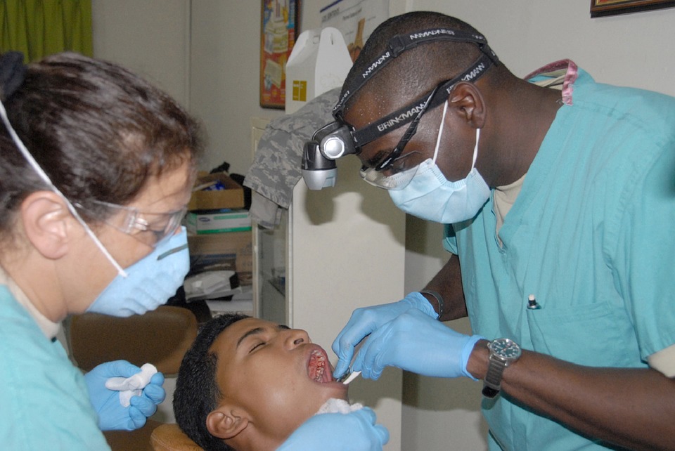 dentist operating his patient